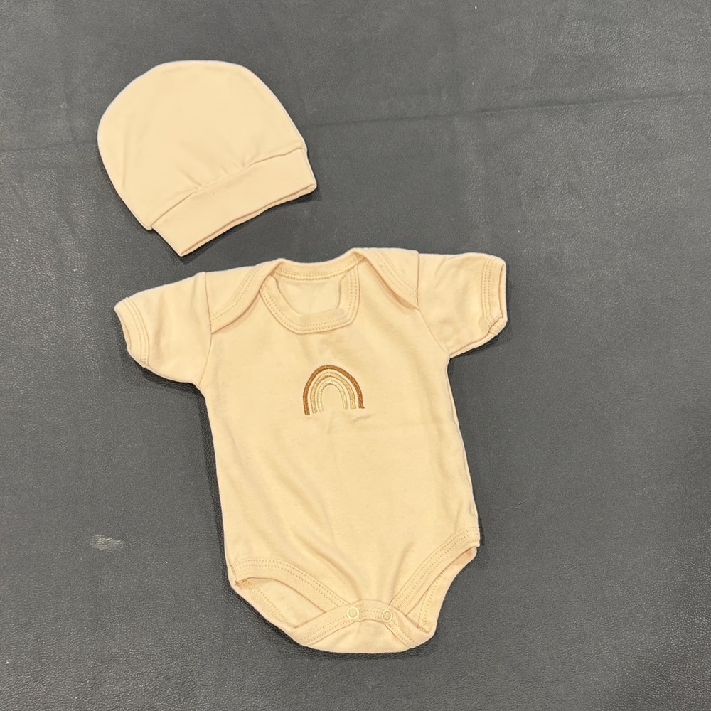 Cream Baby Onesie with Rainbow Design